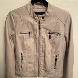 Vegan Leather jacket with furry interior lining.